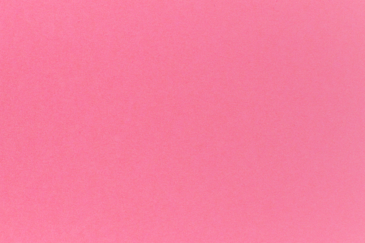 Bright pink crafting paper in close detail.