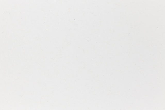 White cardstock paper viewed in close detail.
