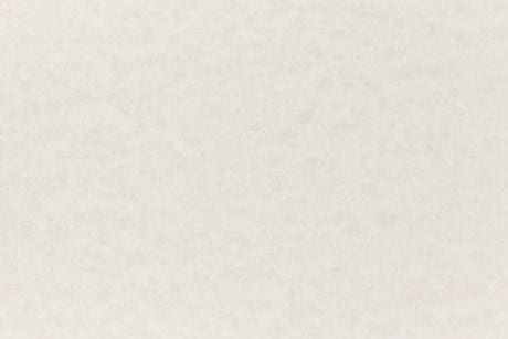 Off-white paper viewed in close detail.