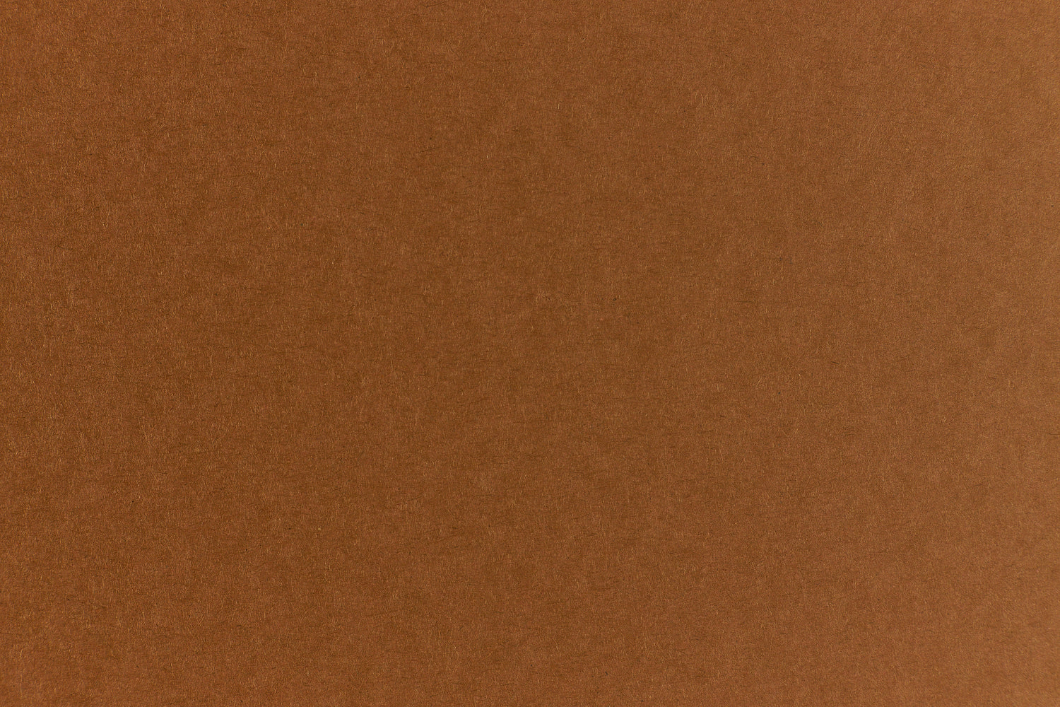 Brown crafting paper with a speckled appearance.