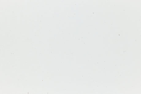 White cardstock with hints of colored fiber.
