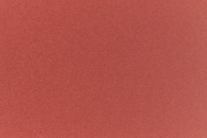 Brick red colored paper sample.