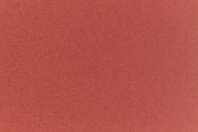 Brick red colored paper sample.