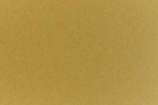 Close up view of green construction-style cardstock paper. 