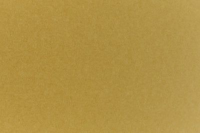 Close up view of green construction-style cardstock paper. 