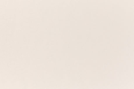 A soft, light pink construction-style cardstock paper viewed closeup.