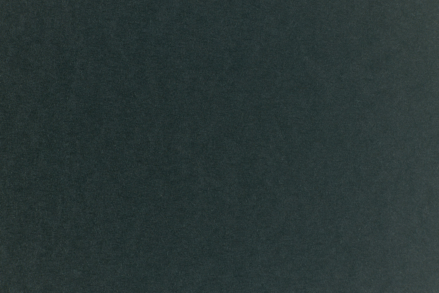 Dark green construction-style cardstock paper in close detail. 