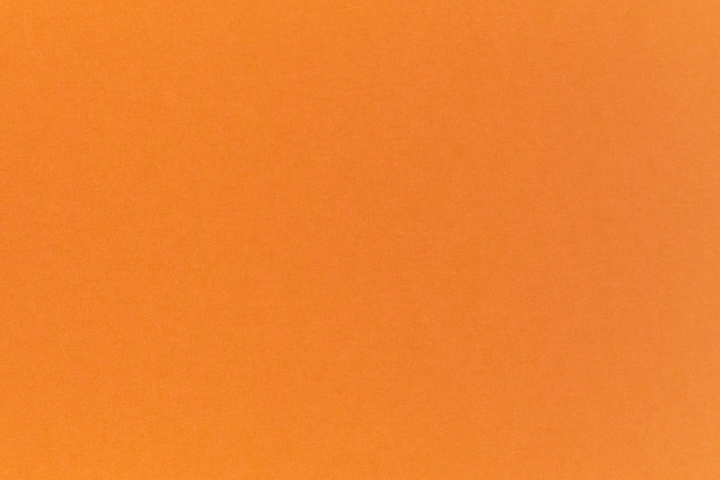 Bright neon orange cardstock paper sample. 