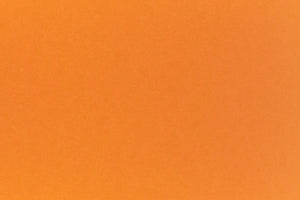 Bright neon orange cardstock paper sample. 