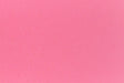 Bright pink crafting paper in close detail.