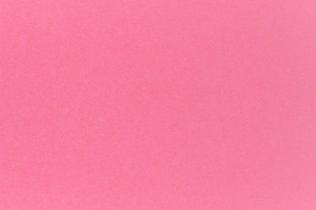Bright pink crafting paper in close detail.