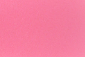 Bright pink crafting paper in close detail.