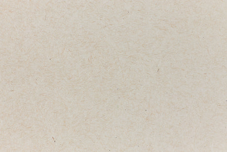 Light brown paper with swirling fibers. 