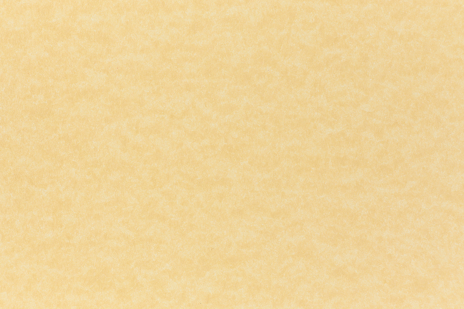 A subdued gold color paper viewed closeup. 