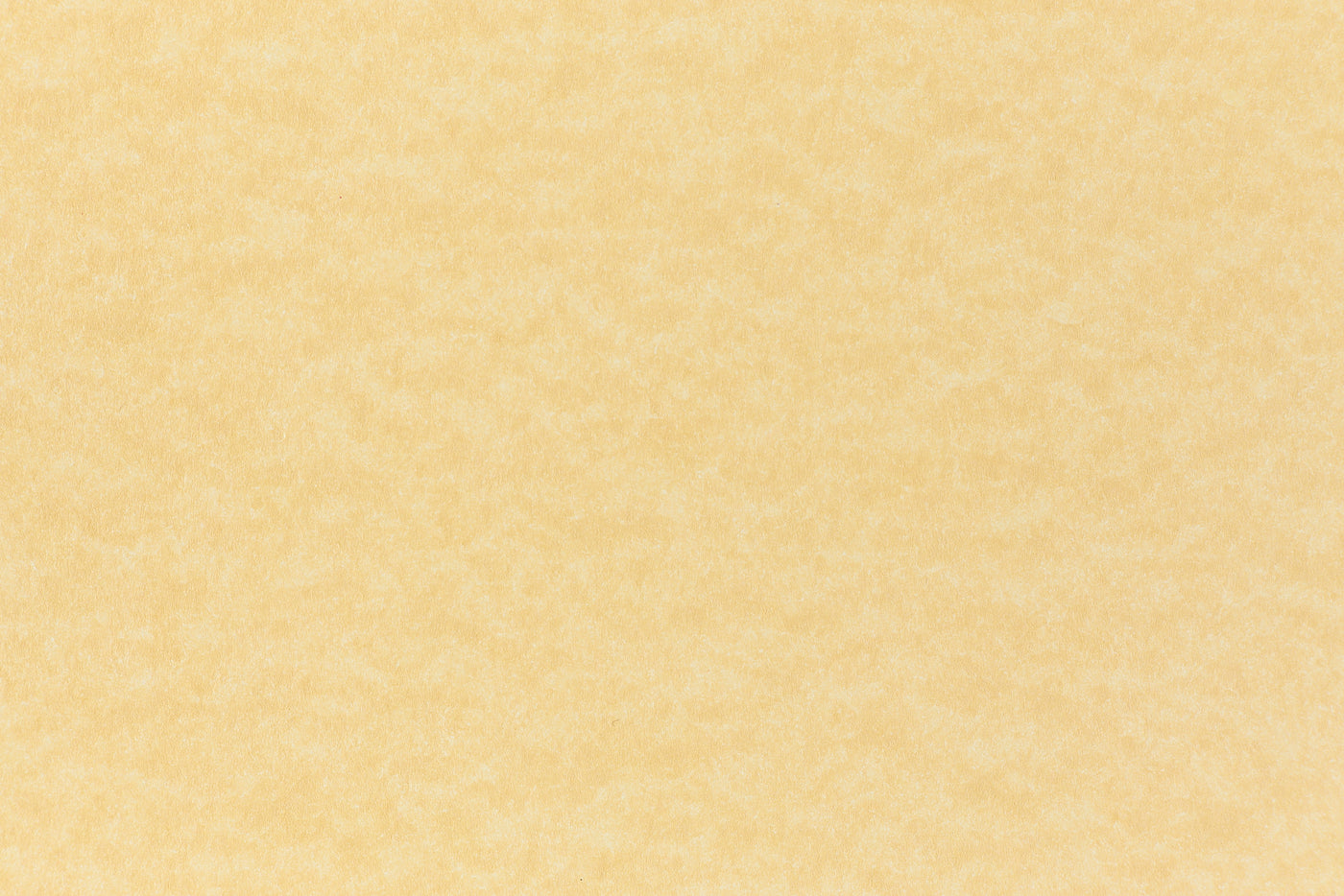 A subdued gold color paper viewed closeup. 