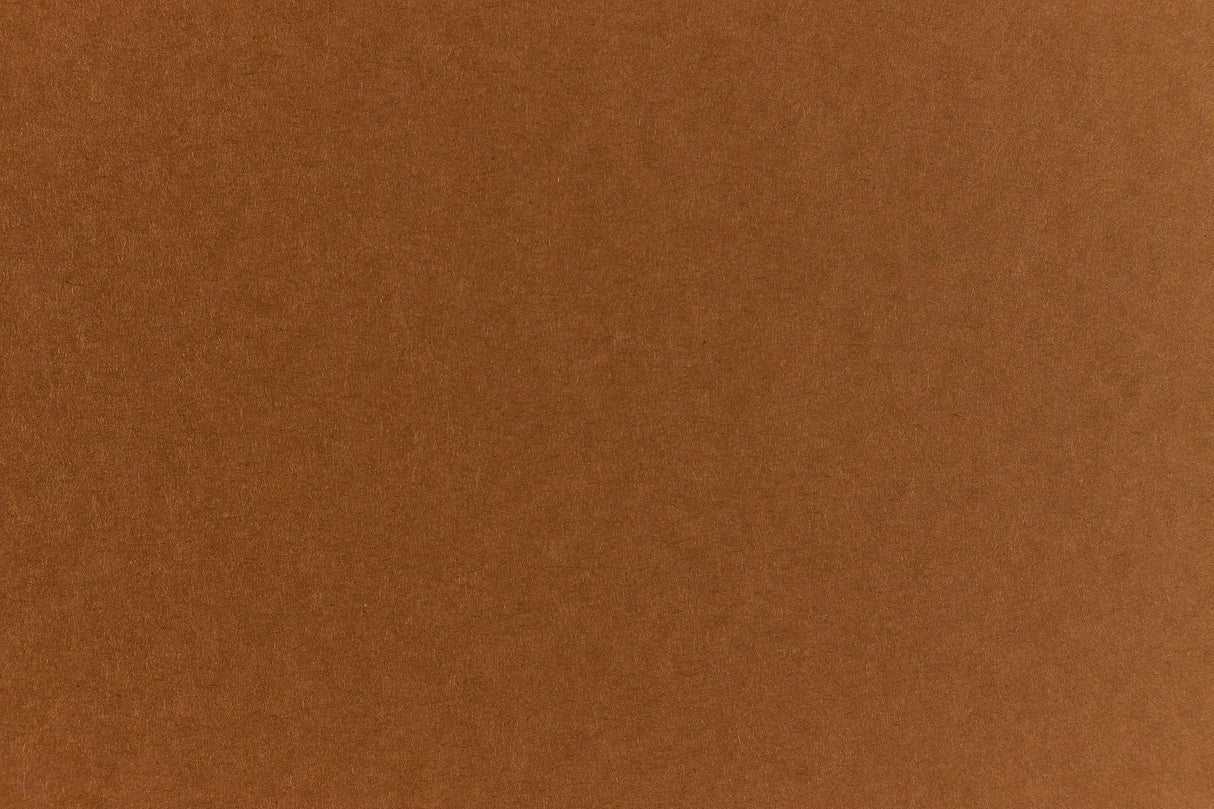 Brown crafting paper with a speckled appearance. 