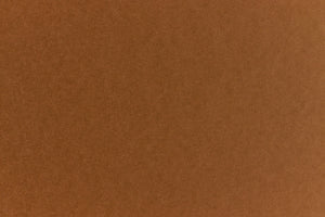 Brown crafting paper with a speckled appearance. 