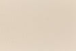 Eggshell-colored and subtly textured construction-style cardstock paper viewed in close detail. 