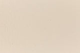 Eggshell-colored and subtly textured construction-style cardstock paper viewed in close detail. 